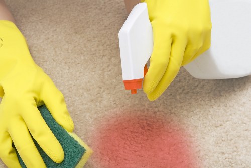 Carpet cleaning team applying health and safety procedures before work begins