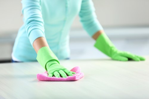Cleaner using protective equipment while handling carpet cleaning products